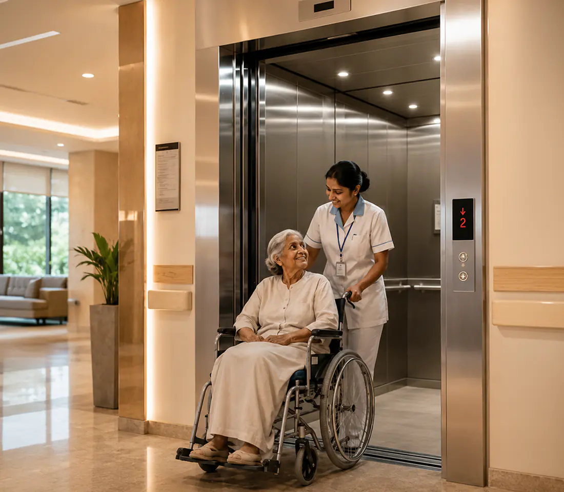 Hospital elevator, patient on a stretcher, attendant smiling beside